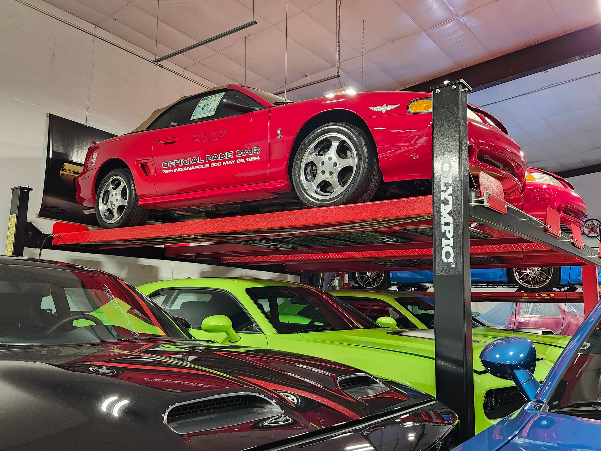 Model: Olympic 4PXW-10 / 10,000-lb. Capacity Two Car Stacker Lift / Four Car Storage Capacity / 78″ Clearance / Drip Trays / 208″ W X 224″ L / 10-Year Warranty / SHIPS FREE!