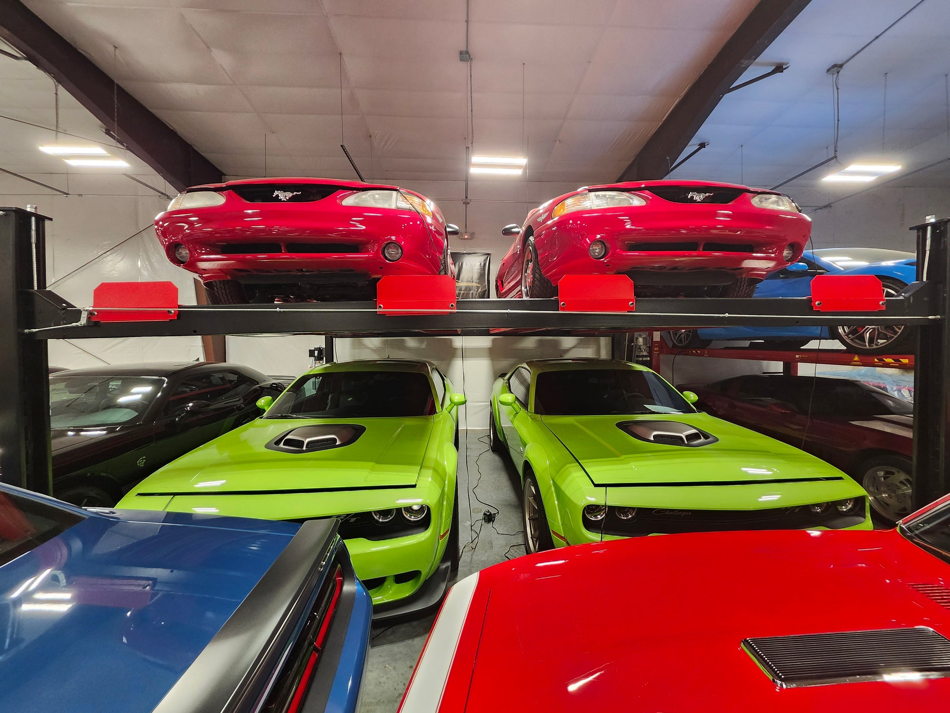 Model: Olympic 4PXW-10 / 10,000-lb. Capacity Two Car Stacker Lift / Four Car Storage Capacity / 78″ Clearance / Drip Trays / 208″ W X 224″ L / 10-Year Warranty / SHIPS FREE!