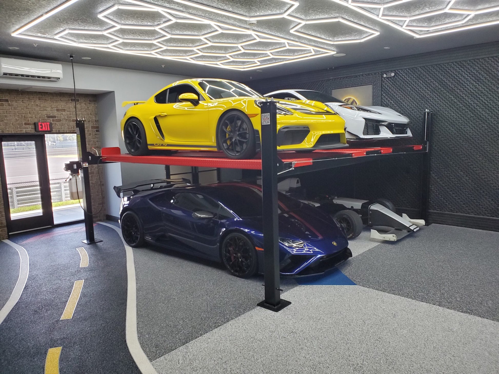 Model: Olympic 4PXW-10 / 10,000-lb. Capacity Two Car Stacker Lift / Four Car Storage Capacity / 78″ Clearance / Drip Trays / 208″ W X 224″ L / 10-Year Warranty / SHIPS FREE!