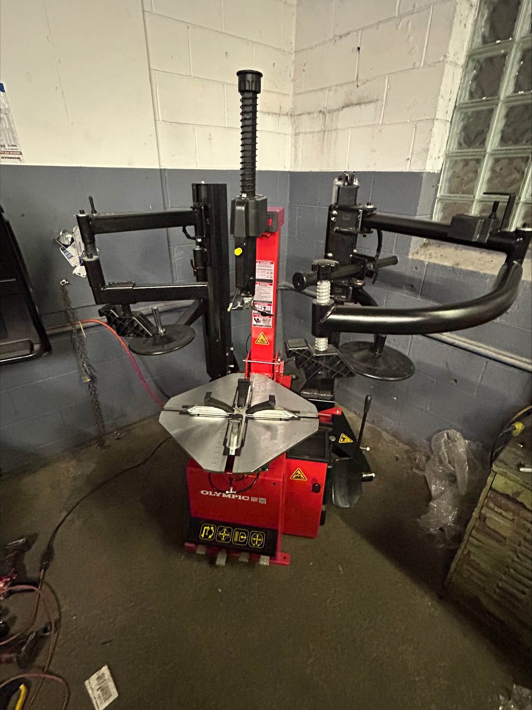 Model: T650 / The Olympic T650 Rim-Lock All-In-One Tire Changer / Pneumatically Operated Tilting Column / Double Assist Arms / Extra Large Capacity / 5-Year Warranty