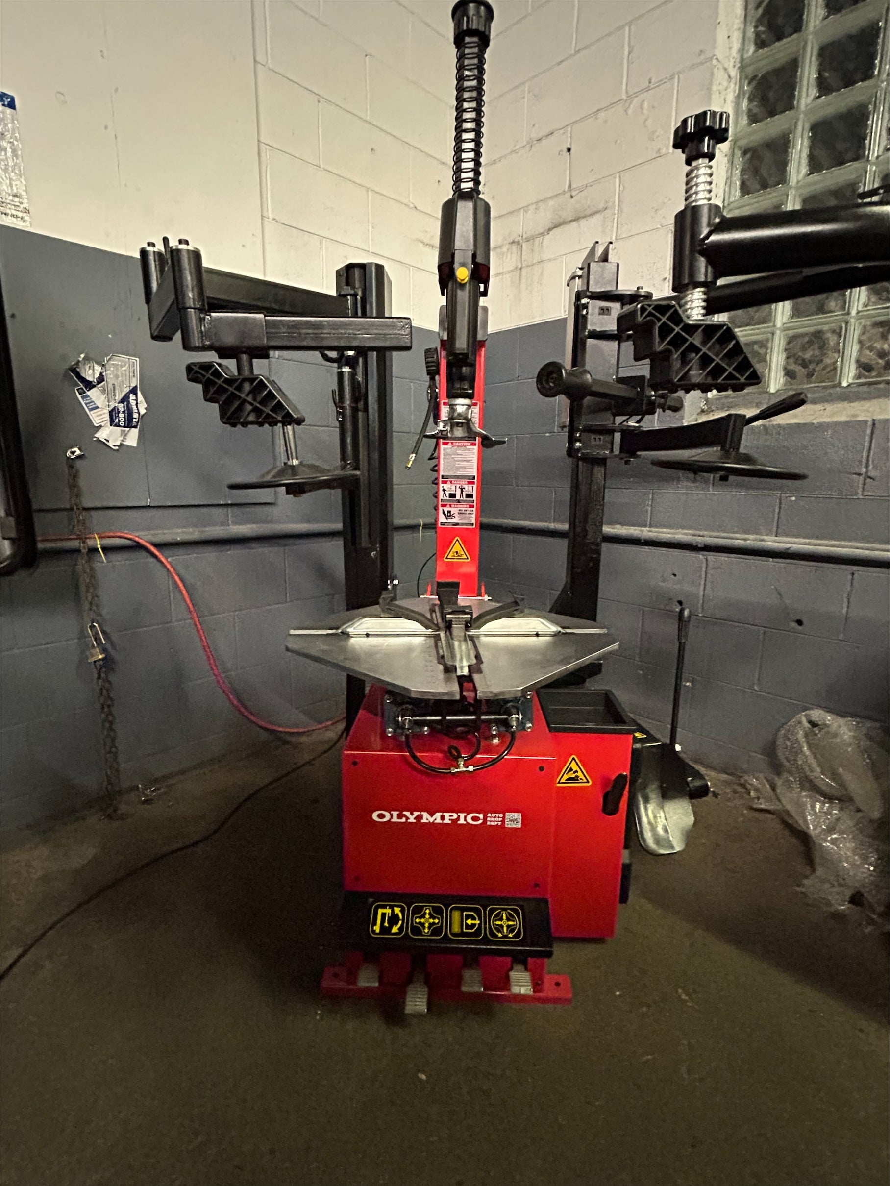 Model: T650 / The Olympic T650 Rim-Lock All-In-One Tire Changer / Pneumatically Operated Tilting Column / Double Assist Arms / Extra Large Capacity / 5-Year Warranty